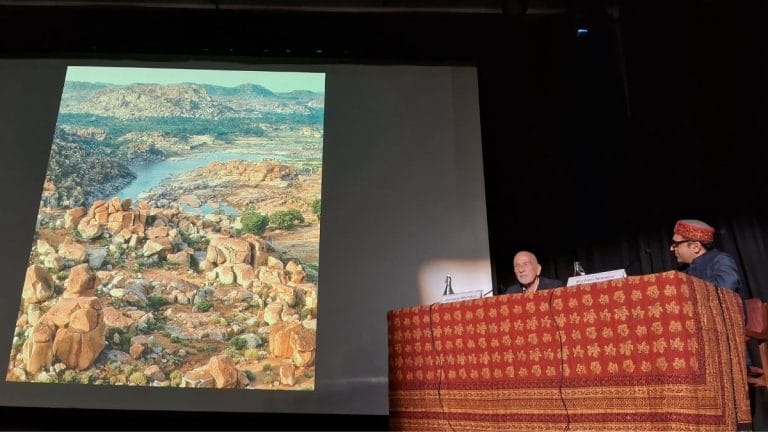 What links Hampi to Indian movies—wet saris and the Queen’s Bath