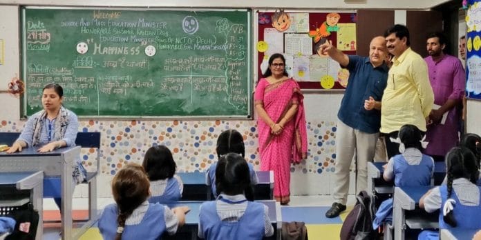 Manish Sisodia with Samir Ranjan Dash, former education minister of Odisha, visiting a Delhi government school in 2019