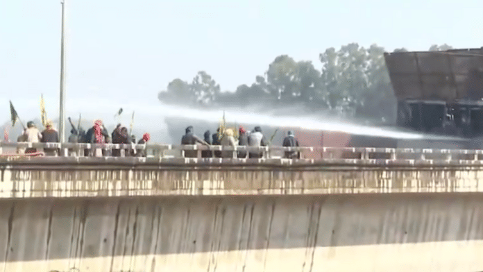 Police use water cannons to disperse protesting farmers at ShambhuBorder. | Screen grab | PTI