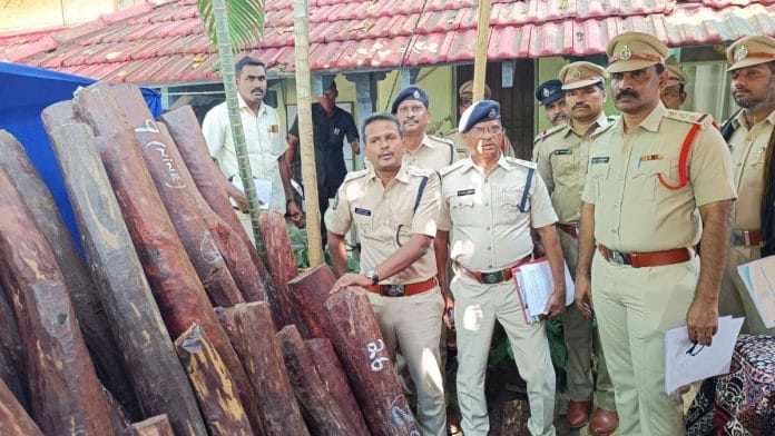 AP Police seized red sanders logs worth Rs 3.5 crore on the Chennai-Kolkata national highway, near Guntur, Wednesday. | By special arrangement