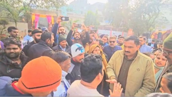 Members of the Hindutva outfits, police personnel and the Christmas event organisers outside the Shiv Punjabi Dharamshala in Rohtak Wednesday | By special arrangement