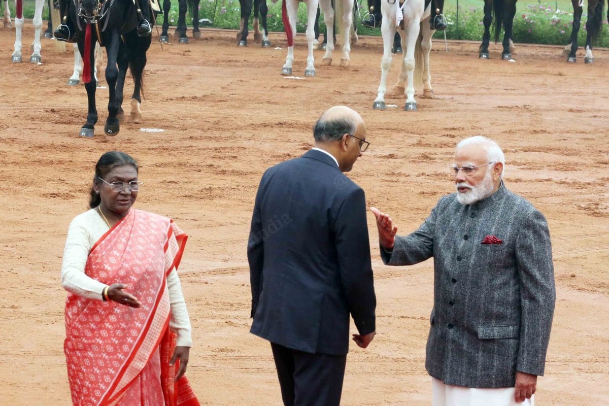 President Murmu and PM Modi asking Tharman Shanmugaratnam to pose for a photo | Praveen Jain | ThePrint