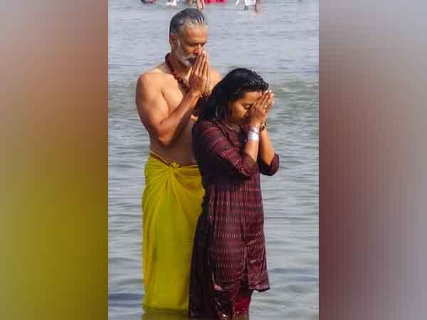 Actor-model Milind Soman takes dip in Sangam with wife Ankita Konwar