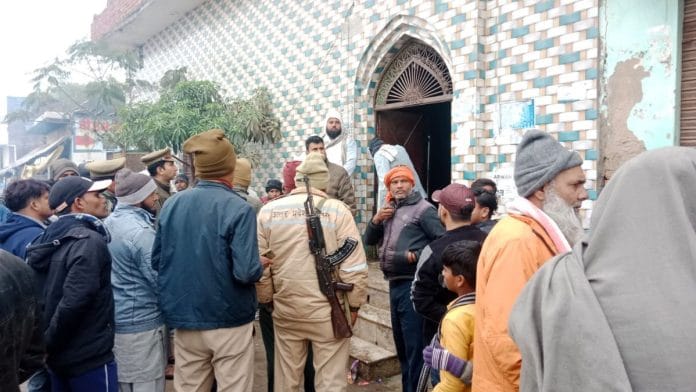 Police and locals outside Teesri Masjid mosque in Agra | Amir Qureshi | ThePrint