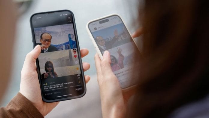 Laura Li, 28, and her cousin Diego Deng, 20, search on the Chinese social media platform Xiaohongshu, in Hong Kong, China, April 30, 2024. Reuters/Tyrone Siu/File Photo