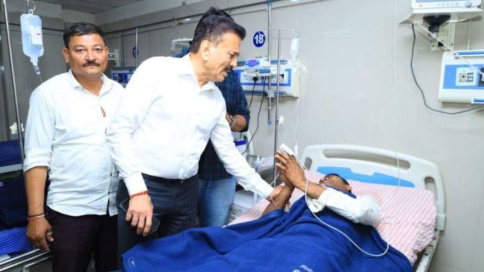 Girish Mahajan meeting one of the injured | X/@girishdmahajan