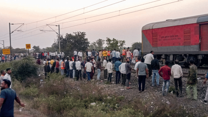 People gather after a train mishap, in Jalgaon district, Maharashtra, Wednesday | PTI