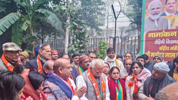 Bharatiya Janata Party (BJP) candidate for the Rohini constituency, Vijender Gupta, with Union Minister Manohar Lal Khattar during a rally ahead of filing nominations for the Delhi Assembly elections, in New Delhi, on 15 January. | ANI