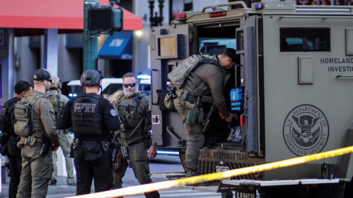 A police officer enters a vehicle, after people were killed by a man driving a truck in an attack during New Year's celebrations, in New Orleans, Louisiana, U.S., on 2 January 2025. | Eduardo Munoz | Reuters