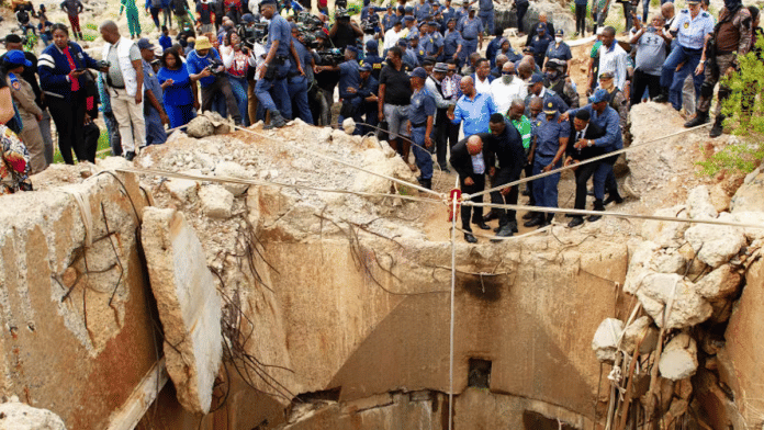 South Africa’s Minister of Police Senzo Mchunu visits the site of an operation to starve illegal miners out from underground. | Elizabeth Sejake | Rapport/Gallo Images via Getty Images