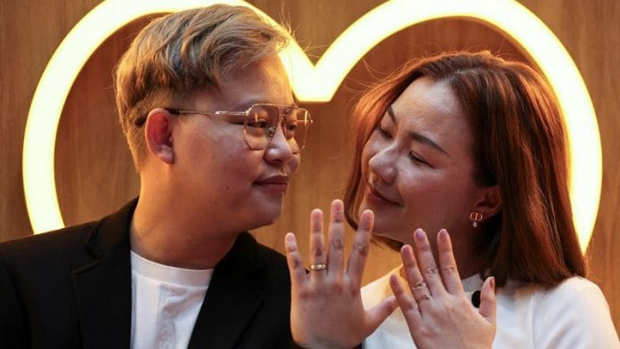 An LBGTQ+ couple, Pawan Iamwet, 35, and Kamonchanok Chumruan, 38, pose for a picture as they wait to receive official marriage certificates, as the country's marriage equality bill comes into effect following a royal endorsement which effectively makes Thailand Asia's third territory to legalise same-sex unions, in Bangkok, Thailand Thusrday | Reuters/Chalinee Thirasupa