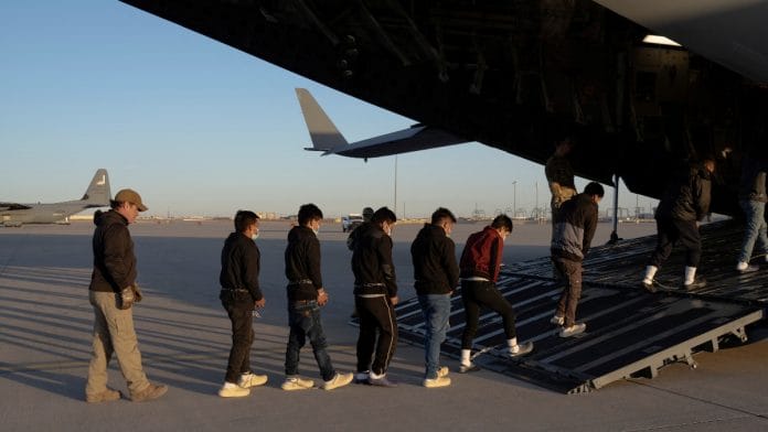Migrants board a C-17 Globemaster III aircraft for a removal flight, Fort Bliss, Texas, January 23, 2025. Dept. of Defense