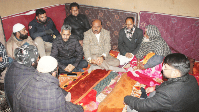J&K Dy CM Surinder Choudhary (wearing light coloured blazer) speaks with kin of deceased in Budhal, Saturday | X/@Surinderch55