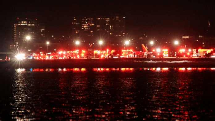 Emergency service vehicles stand near the site of the crash after American Eagle flight 5342 collided with a helicopter while approaching Reagan Washington National Airport and crashed in the Potomac River, outside Washington, US | Reuters/Carlos Barria