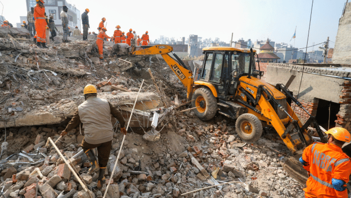 Rescue work underway after a four-storey building collapsed, at Burari area, in New Delhi, Tuesday, on 28 January 2025. At least two people were killed in the incident, according to police. | PTI