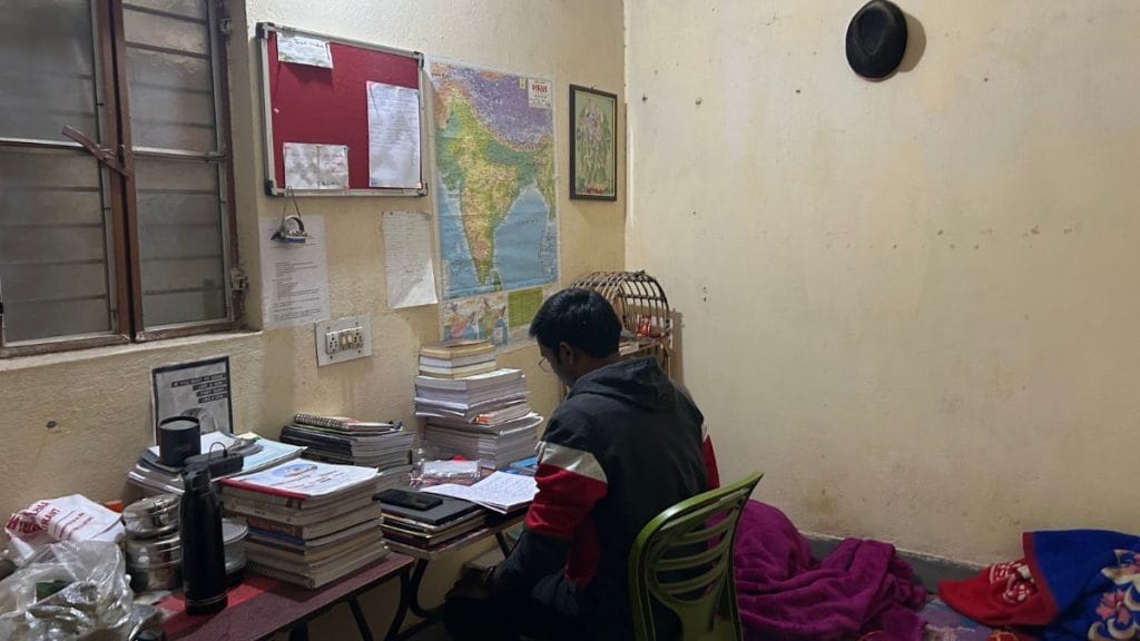 MK, a 28-year-old BPSC aspirant, in his one-room setup. | Jyoti Yadav | ThePrint
