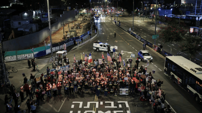 Supporters of Israeli hostages, kidnapped during the deadly 7 October 2023 attack by Hamas, block a road as they demand a deal during a protest amid ongoing negotiations for a ceasefire in Gaza, in Tel Aviv, Israel on 13 January 2025. | Itai Ron | Reuters
