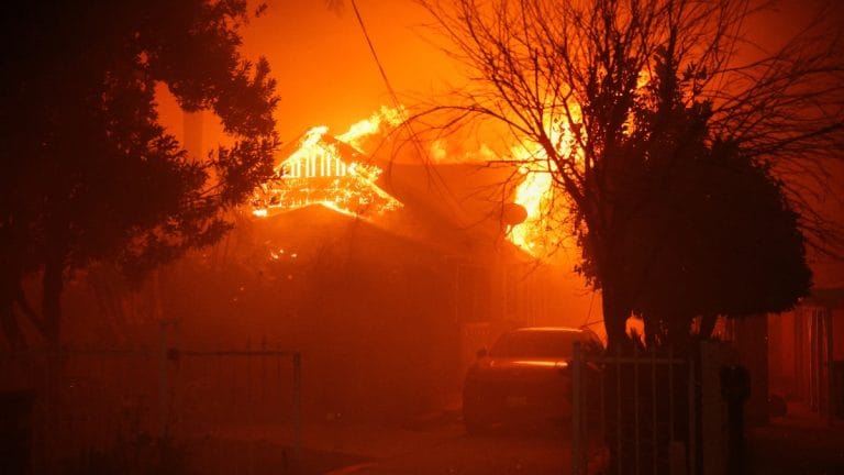 At least 5 dead as five separate wildfires spread across Los Angeles