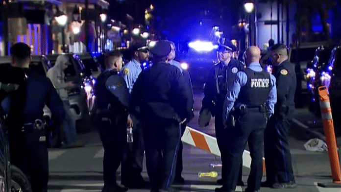 Police officers stand at the scene where a truck drove into a large crowd on Bourbon Street in the French Quarter of New Orleans, Louisiana, U.S. on 1 January 2025 in this screengrab taken from a video. | ABC Affiliate WGNO | Handout via Reuters