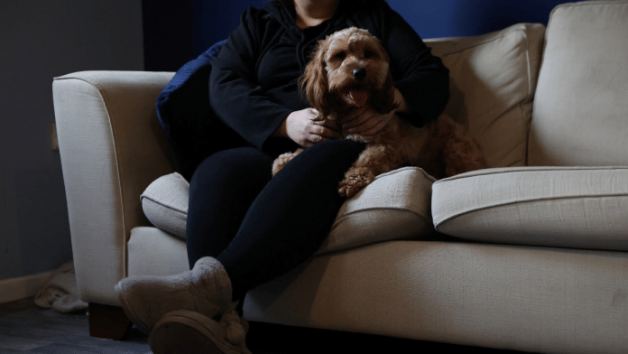 A woman poses at her home in England, Britain, on 8 January 2025. She was 14 when she was sexually abused by a grooming gang in Rochdale. | Hollie Adams | Reuters