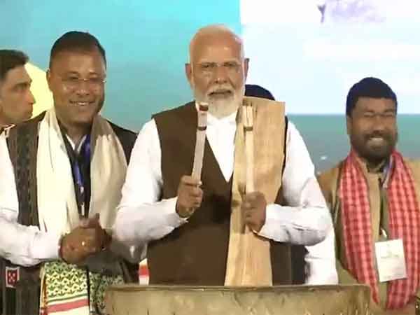Prime Minister Narendra Modi beats traditional drum at 'Jhumoir Binandini' event in Assam