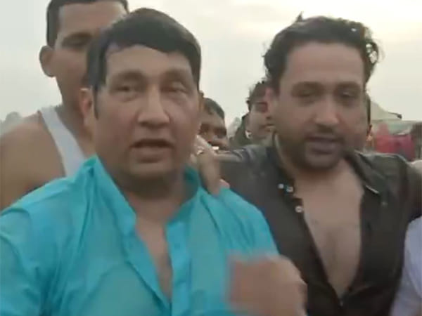 Shekhar Suman, son Adhyayan take holy dip at Maha Kumbh