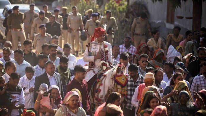 Dalit groom Mukesh Parecha rides a horse in his Gujarat wedding procession