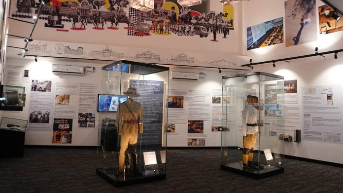 Display showcasing vintage and modern constable uniforms at Bengaluru Traffic Police Museum
