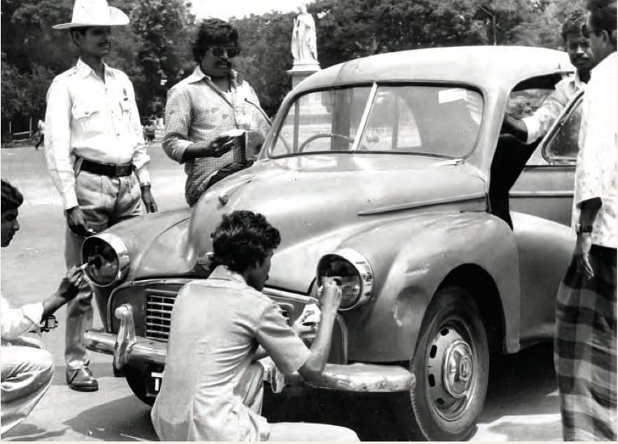 Policeman blackening a car’s headlights as punishment for speeding