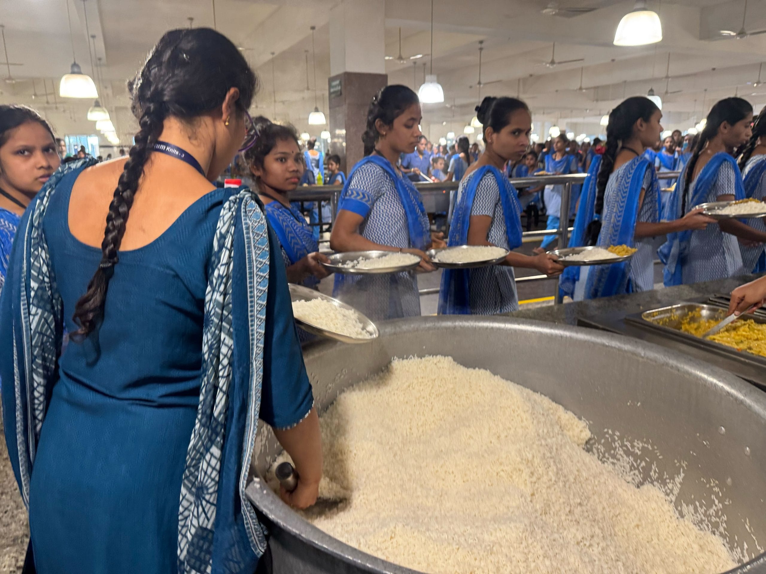 Female workers in the mess helping themselves to rice for lunch | Photo: Sagrika Kissu, ThePrint
