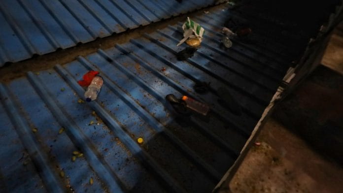 NDLS stampede | Personal belongings strewn about on a tin shed at New Delhi Railway Station | Manisha Mondal | ThePrint