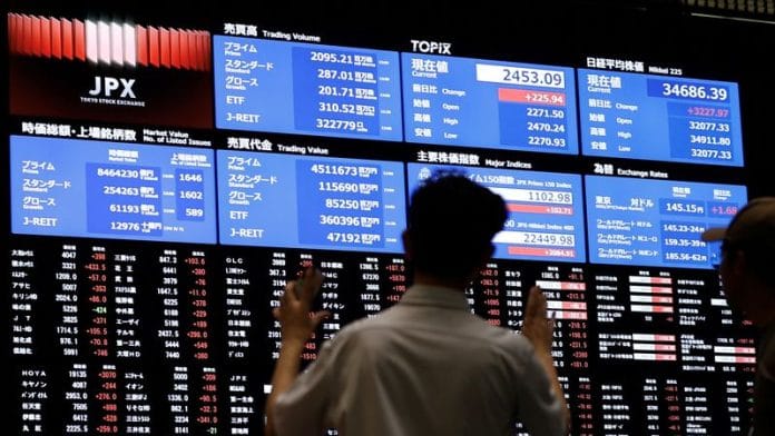 Representational Image | Media members observe the stock quotation board | Reuters/Willy Kurniawan