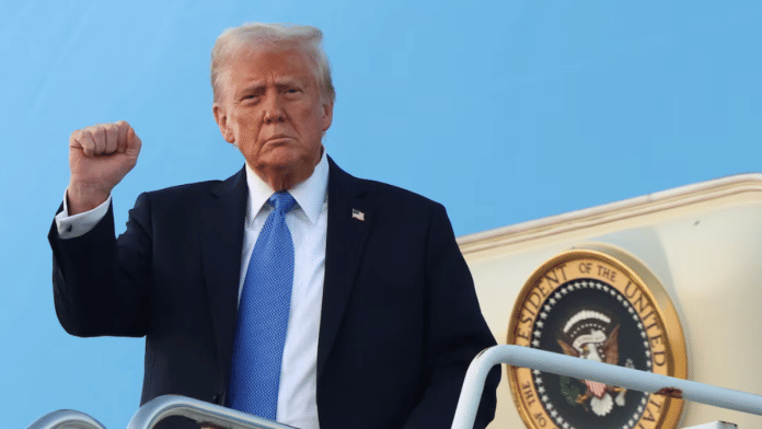 U.S. President Donald Trump raises his fist as he steps from Air Force One upon arrival in West Palm Beach, Florida, U.S., on 7 February 2025. | File Photo | Kevin Lamarque | Reuters