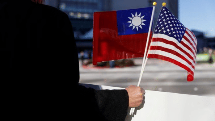 Man holding Taiwan (left) and US (right) flags together | Representational image | Reuters