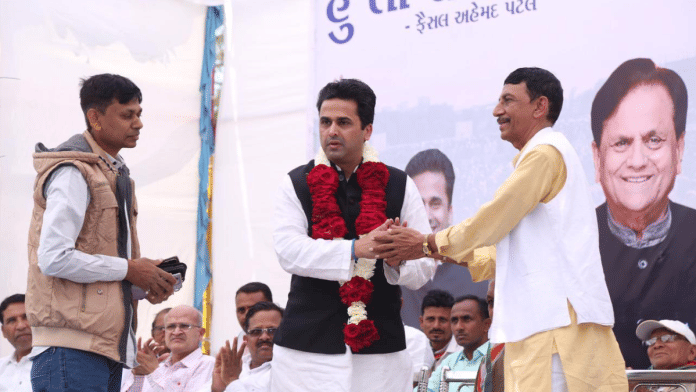 File photo of Faisal Patel (centre) at an adivasi jan jagruti programme at Dediapada, Gujarat. His father Ahmed Patel's picture can be seen on the banner | X/@mfaisalpatel