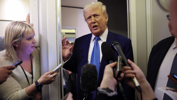 U.S. President Donald Trump speaks to reporters aboard Air Force One on his return to Washington, U.S., February 19, 2025 | Reuters