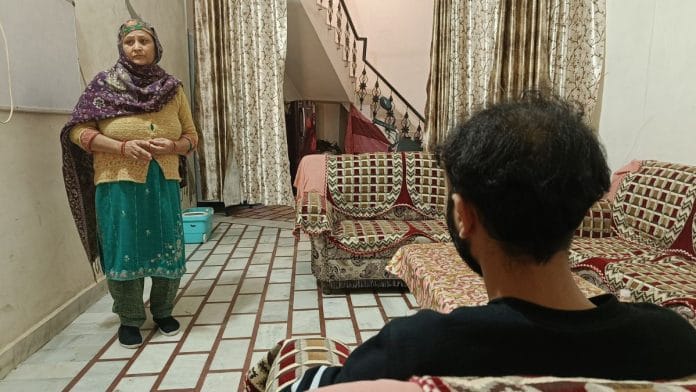 Robin Handa (back to the camera; he refused to reveal his face) was among the 104 illegals to be deported to India from the US. He is relieved to be back home, but doesn't know what lies ahead | Photo: Krishan Murari, ThePrint