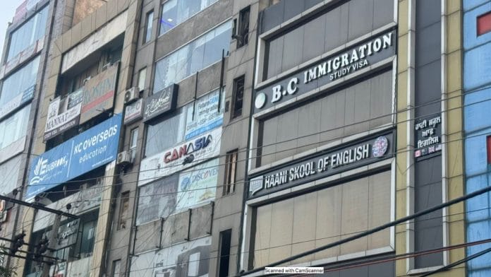 The upscale Ranjit Avenue in Amritsar is lined with billboards of immigration centres, each selling a dream