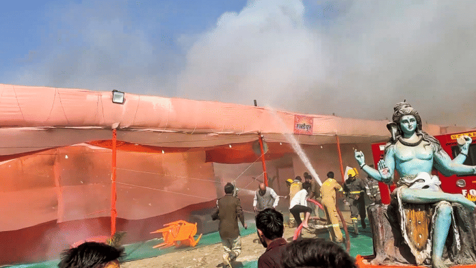 Fire-fighters and security personnel try to control the situation after a fire broke out at Sector 18 in Maha Kumbh area, in Prayagraj, Friday | PTI