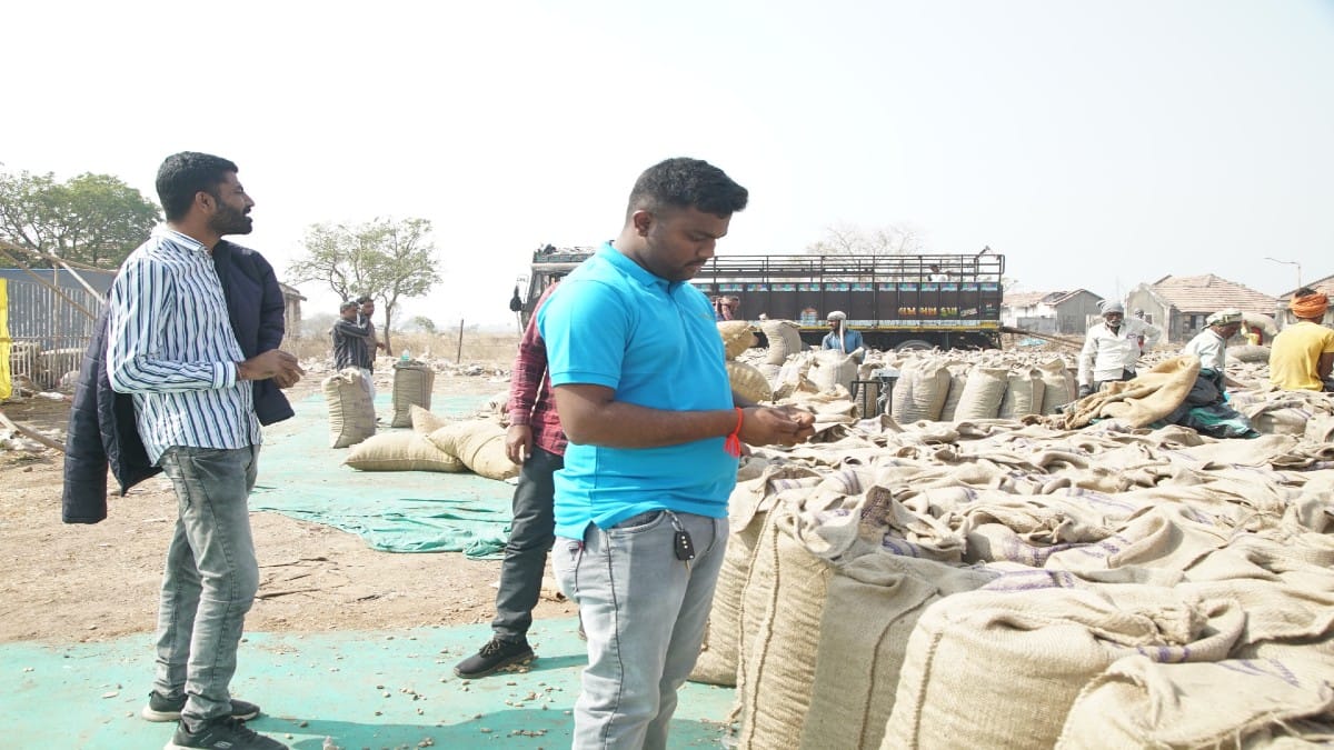 An Arya.ag employee with farmers | By special arrangement