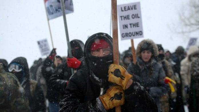 File photo of a Native American man leading a protest march against the Dakota Access pipeline in 2016 | Photo: REUTERS/Stephen Yang