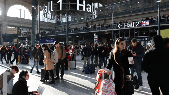 Passengers wait inside the departure hall as traffic has been disrupted at the Gare du Nord train station following the discovery of an unexploded bomb dating back to World War Two 2.5 km (1.55 miles) from the train station, in the middle of the train tracks, France, on 7 March 2025. | Benoit Tessier | Reuters
