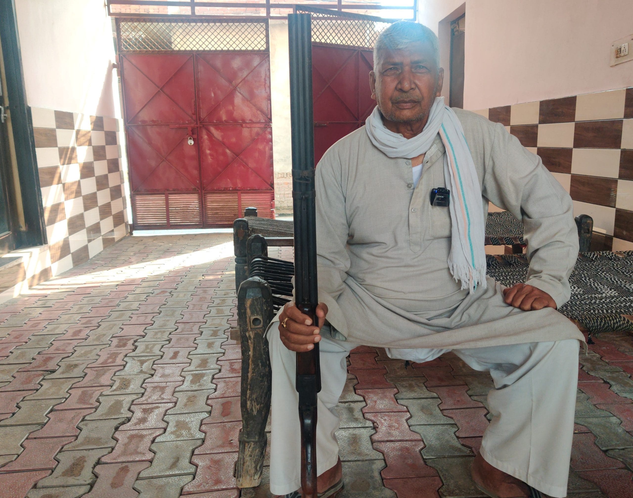 Yadav holds his old gun at his house in Shahpur Bamheta village, licensed in 1992, untouched for six years—last fired to celebrate his grandson's birth | Sakshi Mehra, ThePrint
