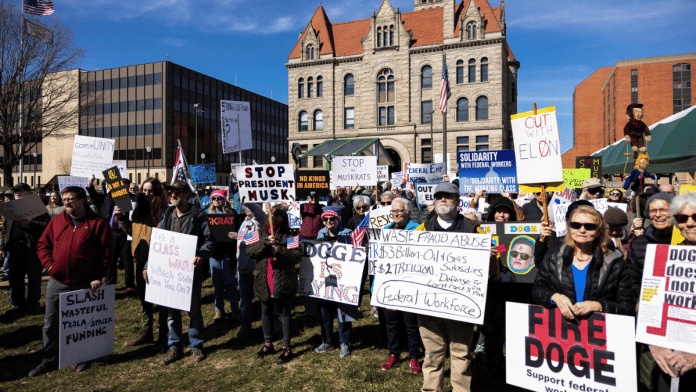 Protesters are seen at a rally standing up for Federal Workers in downtown Parkersburg, West Virginia, US | Reuters/Megan Jelinger