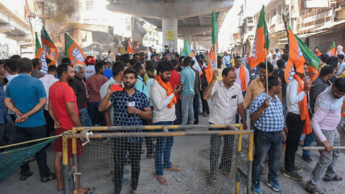 BJP supporters block a road during the 'Ranchi Bandh' called by Jharkhand BJP and All Jharkhand Students Union (AJSU) against the murder of BJP leader and former Zila Parishad member Anil Mahto alias Anil Tiger, in Ranchi, Thursday | PTI