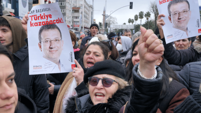 Supporters of Istanbul Mayor Ekrem Imamoglu gather near the city's police headquarters in Istanbul, Turkey, on 19 March 2025. | Tolga Uluturk | Reuters
