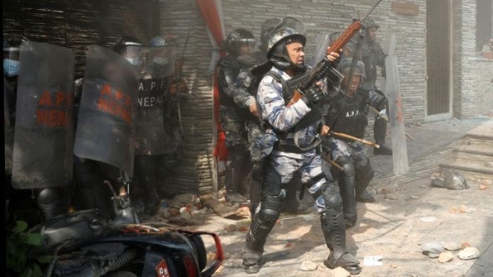 Riot police personnel in action during a protest by pro-monarchist demonstrators demanding the restoration of Nepal's monarchy, which was abolished in 2008, saying the governments have failed to make any significant changes, in Kathmandu, Nepal | Reuters/Navesh Chitrakar