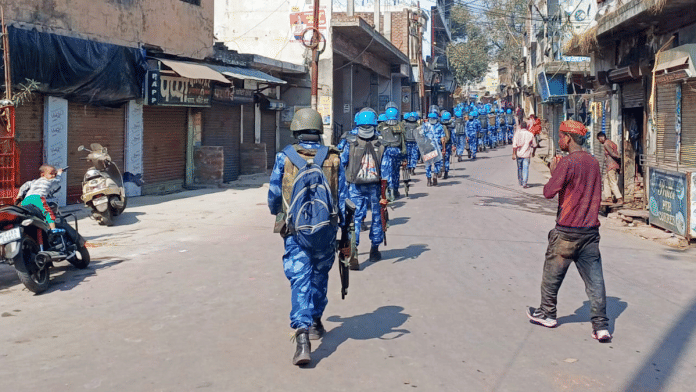 File photo of RAF personnel conducting a flag march amid heightened security for Holi and Ramzan in Sambhal I PTI