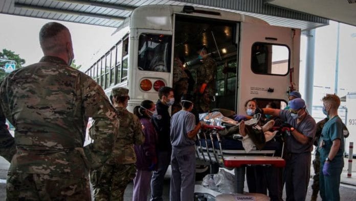 US Soldiers, Airmen and civilian staff receive casualties who were injured outside of Hamid Karzai International Airport and evacuated for further care in Germany | Landstuhl Regional Medical Center/Marcy Sanchez/Handout via Reuters