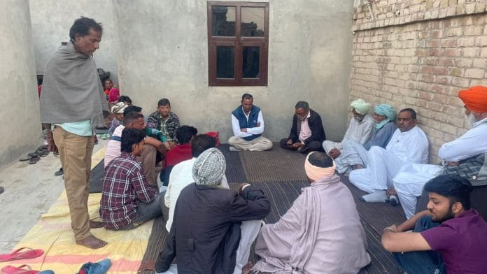 In Sandeep's village near Kesrisinghpur, a crowd sit quietly | Udit Hinduja, ThePrint